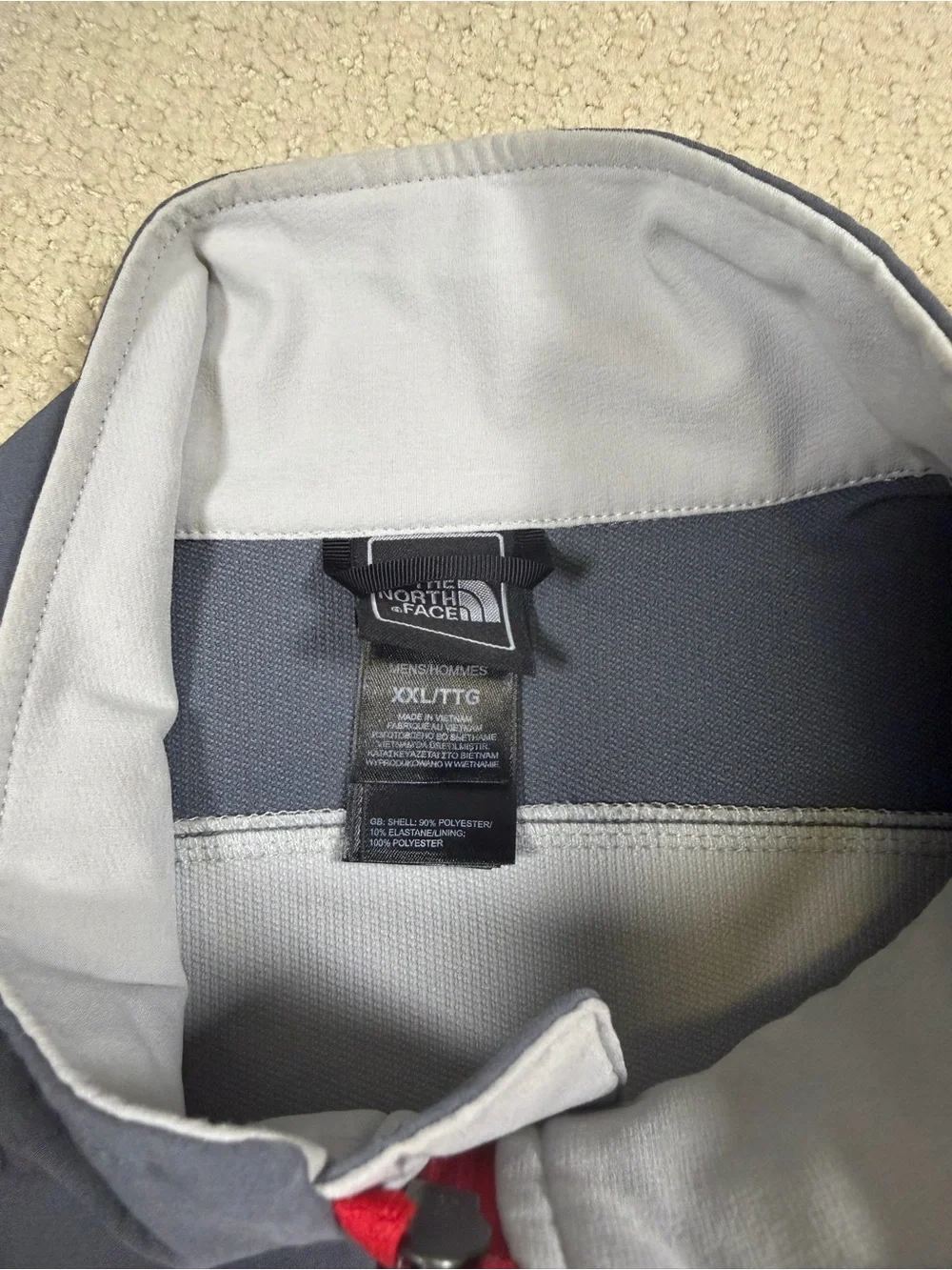 The North Face Men’s Gray Jacket with Red Zipper